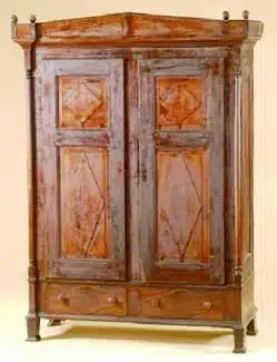 Photo with caption: An Oldenburg walnut and maple schrank,
knockdown type, with poplar secondary woods.
Image from Cowan’s Auctions.