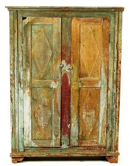 Photo with caption: An Oldenburg double-sided cupboard that retained several
coats of old paint.
Image from Cowan’s Auctions.