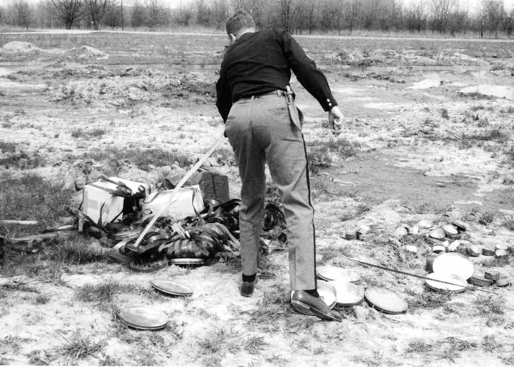 Photo with caption: A pile of historic highly flammable nitrate films ready to be set on fire. Newman collection, FCPLD.