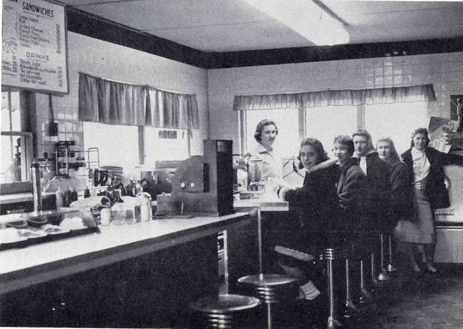Photo with caption: Interior of the Elm Drive-In from the 1959 Brooklet yearbook advertisement.