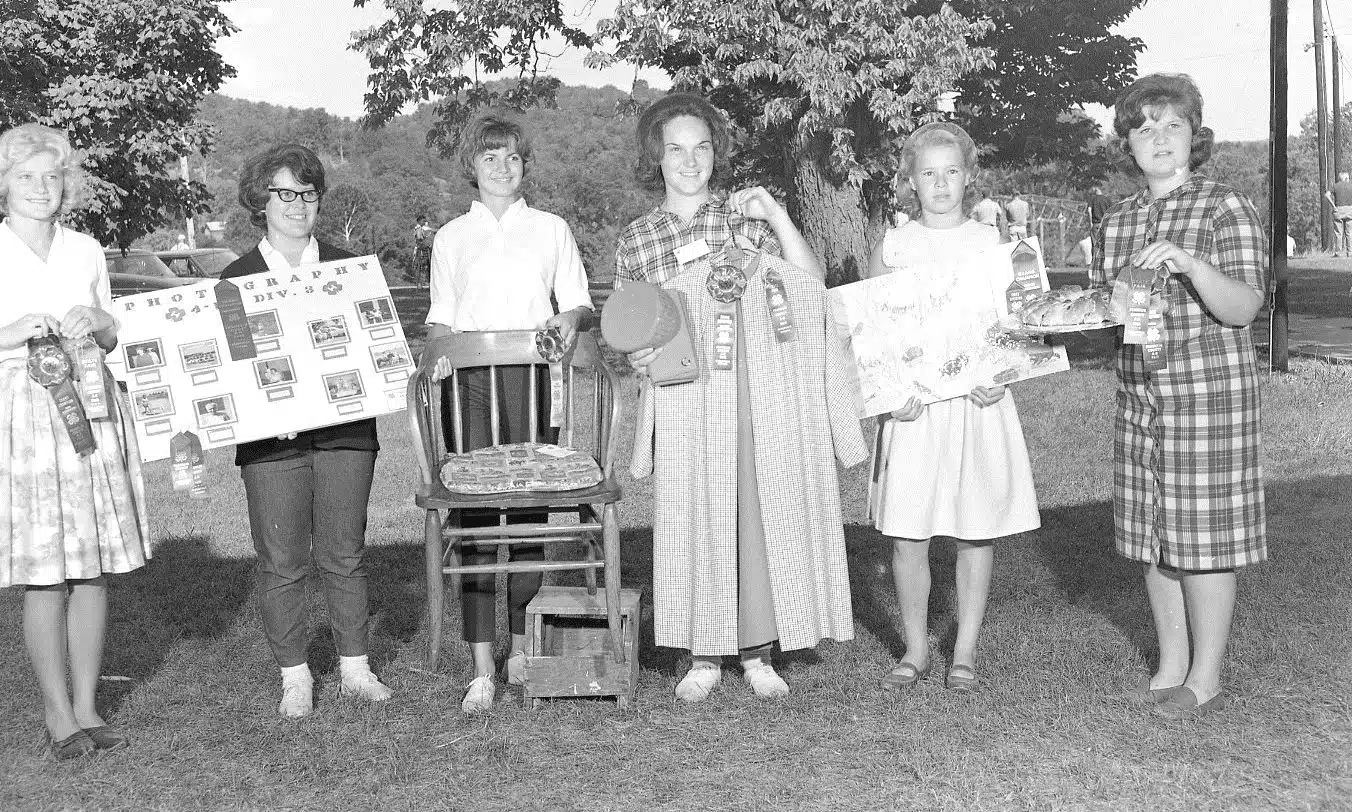 Photo with caption: Blue ribbon winners at the Franklin County 4-H Fair, circa 1962.
Left to right: Becky Bruns Lanning, Mary Cleaver, Debbie Baker, Dee Willhite Harding,                       Dee or Delores Smith (twins), and unknown.
Image courtesy of Tami Wissman Hofer.