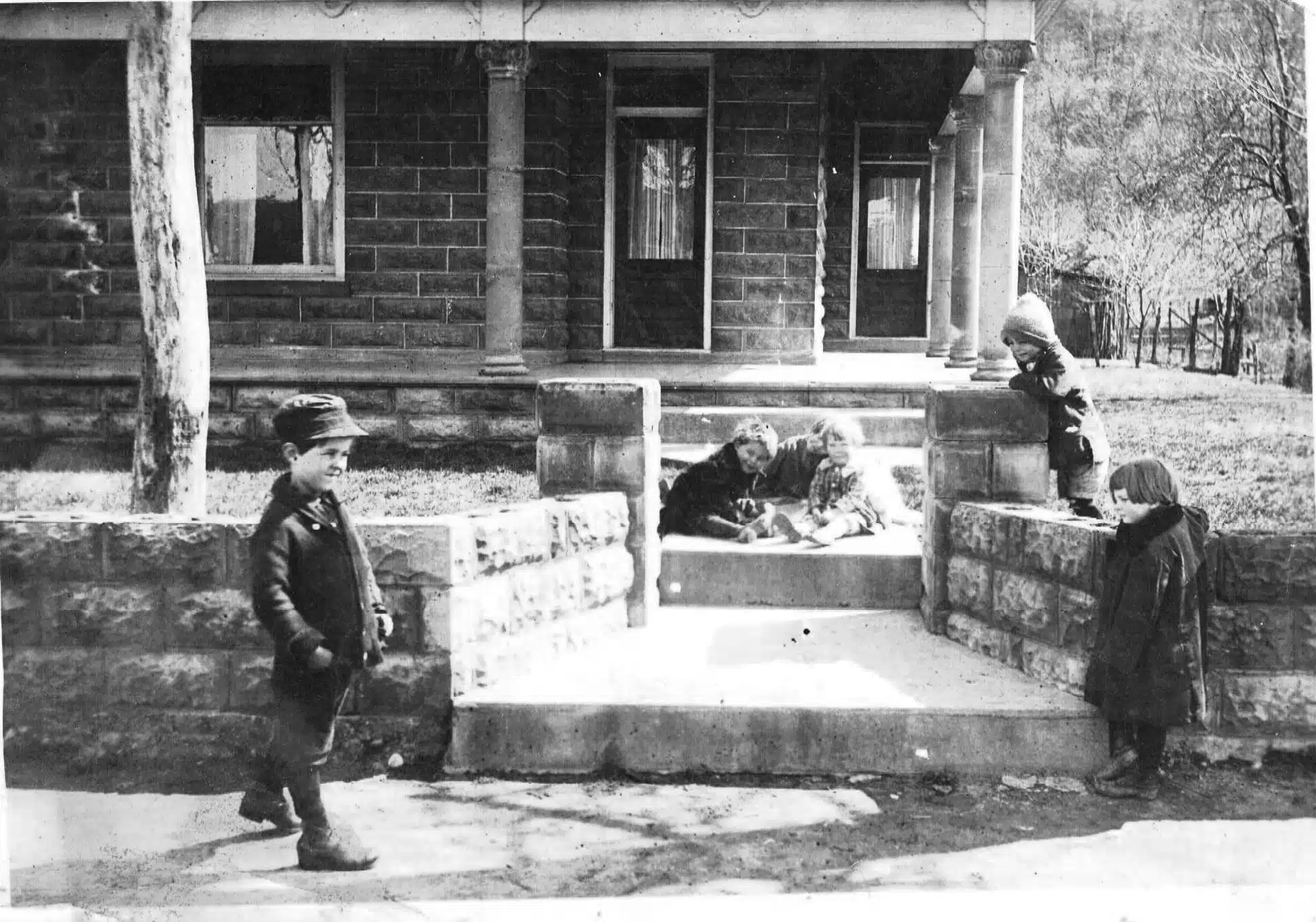 Photo with caption: The William Lake home as photographed by Lester Lake circa 1920. Clyde Lake is the boy walking.