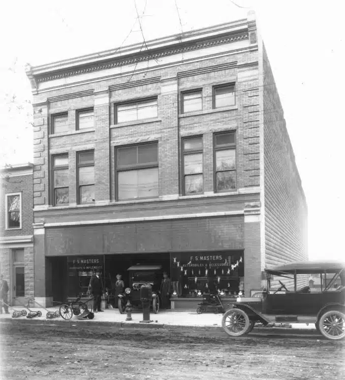 Photo with caption: This was the Masters building that replaced the old land office. FCPLD collection.
As the Masters Store was being built, the April 29, 1914 Democrat said “A copy of this issue of the Democrat and the other county papers and a number of other documents will be placed in one of the hollow concrete blocks at the northeast corner of the building being erected by Frank Masters for his hardware store on the site of the old Land Office of pioneer days.”