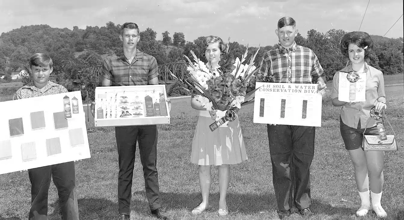 Photo with caption: Blue ribbon winners at the Franklin County 4-H Fair, circa 1962.
Left to right: unknown, unknown, unknown, Roger Boomer, and Deanna Miles.
Image courtesy of Tami Wissman Hofer.